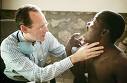 paul farmer examining a patient